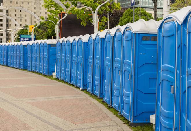 a row of portable restrooms at a fairground, offering visitors a clean and hassle-free experience in Brownstown, PA